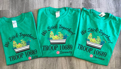 The cutest colorful Girl Scout Tees ! Personalized with troop number , masks or no masks and name   Cactus can be with or without masks - please note in personalization section when you check out   We stick together tee with names and troop number personalized on each shirt